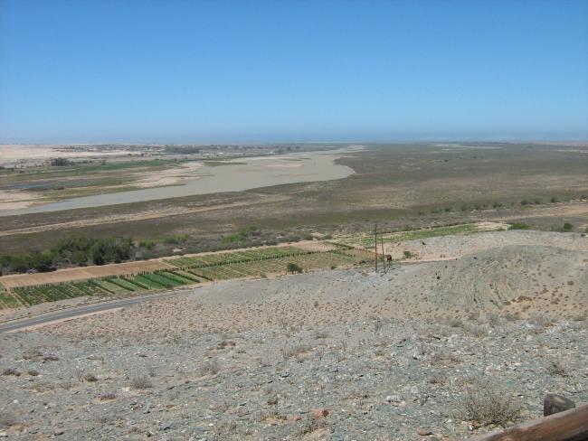 View of the Orange River Mouth from Swartkop looking west.  The river mouth is in the centre of the picture.