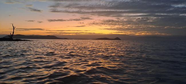 The little islands in Lake Baringo are illuminated by the setting sun.