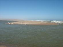 The Orange River Mouth from the Namibian side looking south.  Pelicans, cormorants and large flocks of terns are using the sandspit as a roost.
