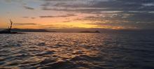 The little islands in Lake Baringo are illuminated by the setting sun.