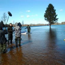 The flood "fifth" season in Soomaa NP. Flooded road in Riisa village.